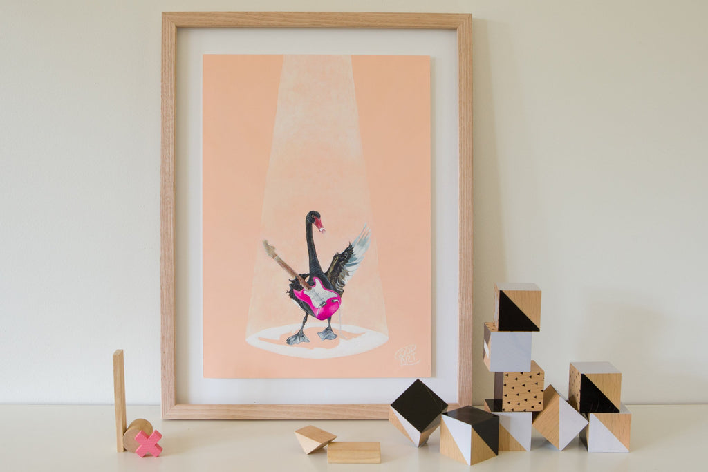 A painting of a Western Australian black swan playing a pink electric guitar on blush coloured background. A colourful animal print for kids bedroom painted by Jaelle Pedroli.